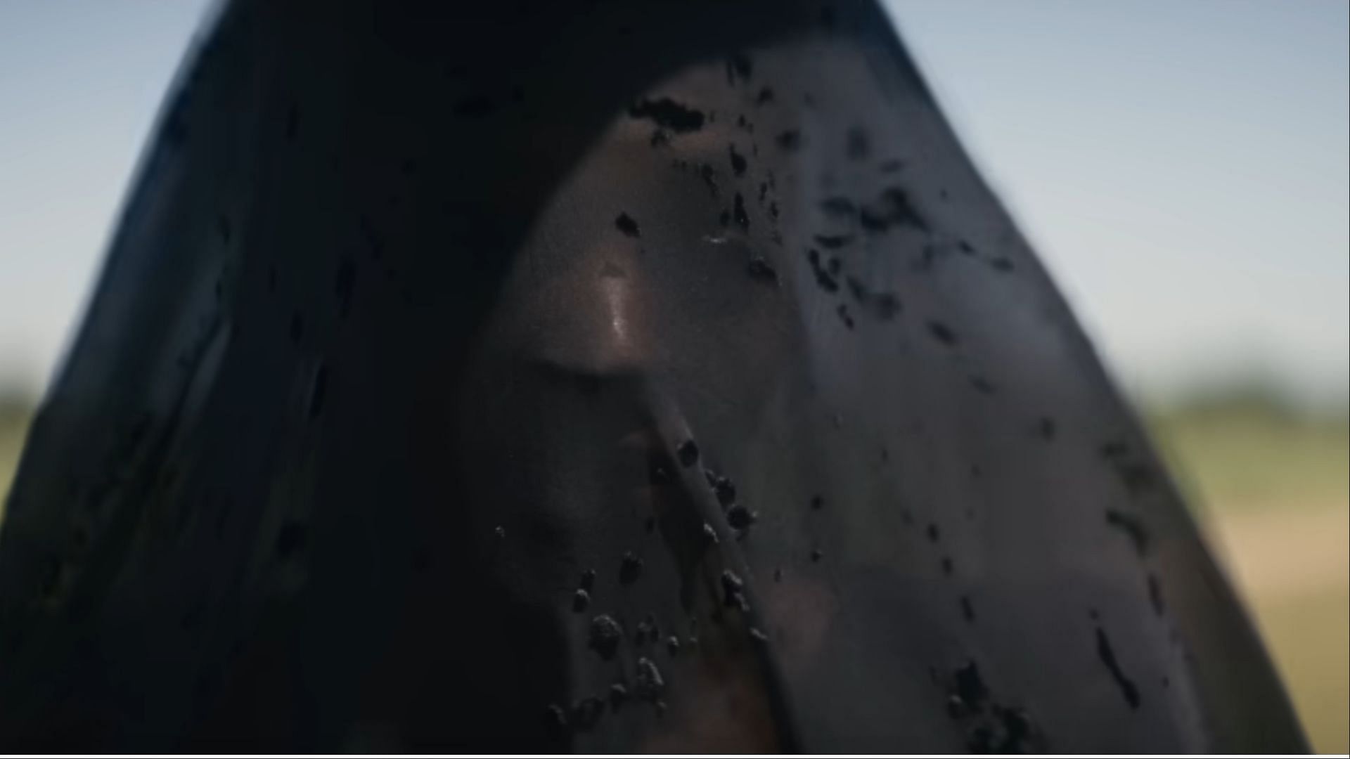 A haunting close-up from The Woman in the Yard reveals a face obscured by decaying lace, a visual metaphor for internal ruin (Image via Universal Pictures)